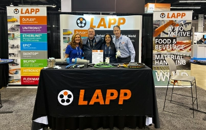 Victoria, Steve, Fifi, and Paul standing in front of the LAPP booth at ATX West