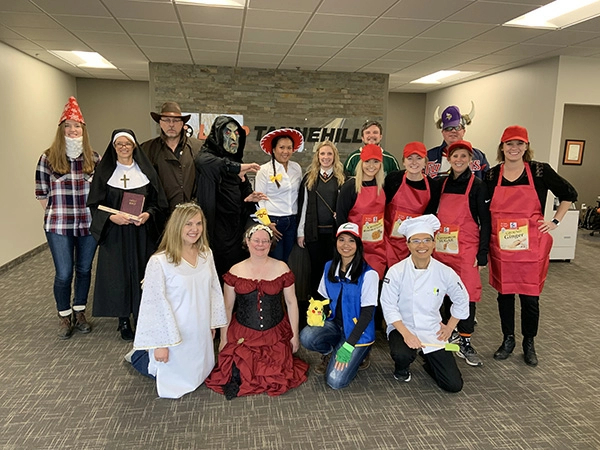 Employees dressed up in their halloween costumes